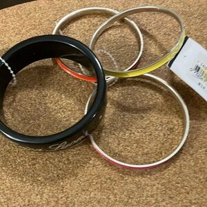 4 beautiful bracelets, one is Erica Lyons, these were purchased many years ago ￼